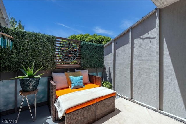 17072 Pacific Coast Unit 202, Huntington Beach, CA 92649 - view of patio / terrace featuring fence