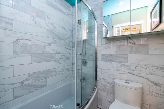 17072 Pacific Coast Unit 202, Huntington Beach, CA 92649 - full bath featuring toilet, enclosed tub / shower combo, and tile walls