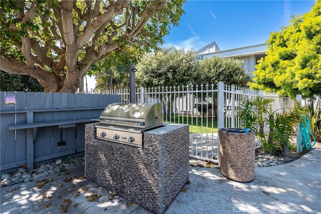 17072 Pacific Coast Unit 202, Huntington Beach, CA 92649 - view of patio / terrace featuring fence and area for grilling