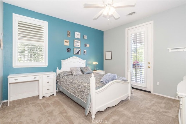 bedroom featuring light colored carpet, access to outside, baseboards, and a ceiling fan