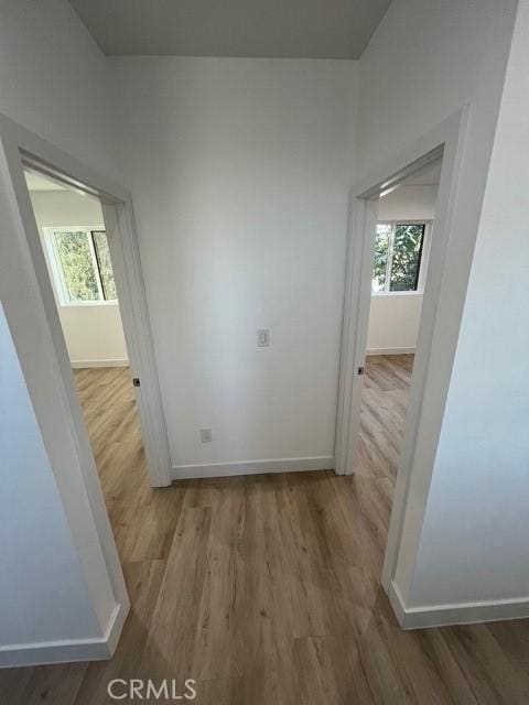 1217 E 22nd St, Los Angeles, CA 90011 - hall featuring wood finished floors and baseboards