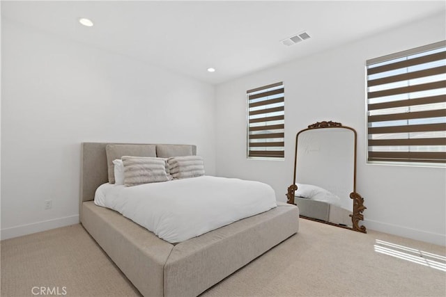 bedroom featuring carpet, baseboards, and recessed lighting