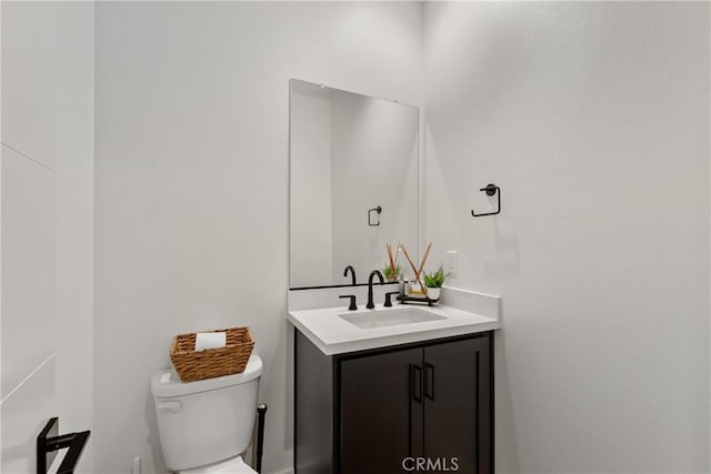 half bath with vanity and toilet