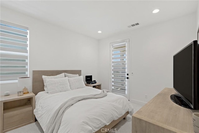 carpeted bedroom with baseboards and recessed lighting