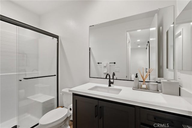 full bath featuring a shower stall, toilet, vanity, and recessed lighting