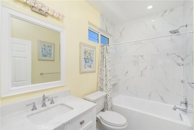 full bathroom with shower / bath combo with shower curtain, vanity, and toilet