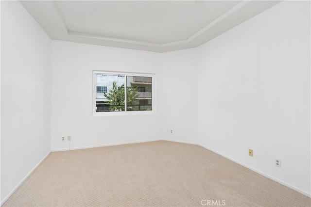 4230 Colfax Ave Unit 103, Studio City, CA 91604 - unfurnished room with a raised ceiling, carpet floors, and baseboards
