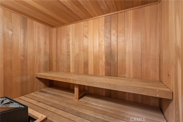 relaxing sauna with wooden walls and wood ceiling