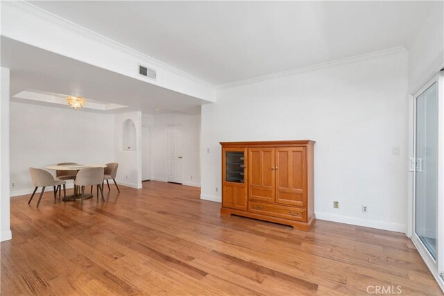 4230 Colfax Ave Unit 103, Studio City, CA 91604 - living area with light wood-type flooring, ornamental molding, baseboards, and arched walkways