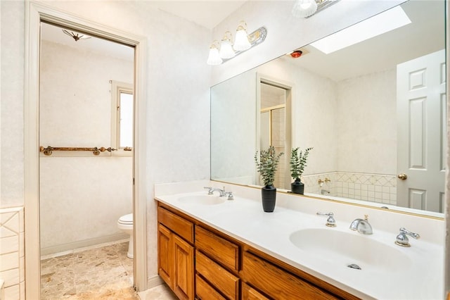 321 13th St, Huntington Beach, CA 92648 - full bath with a skylight, toilet, a shower stall, double vanity, and a garden tub