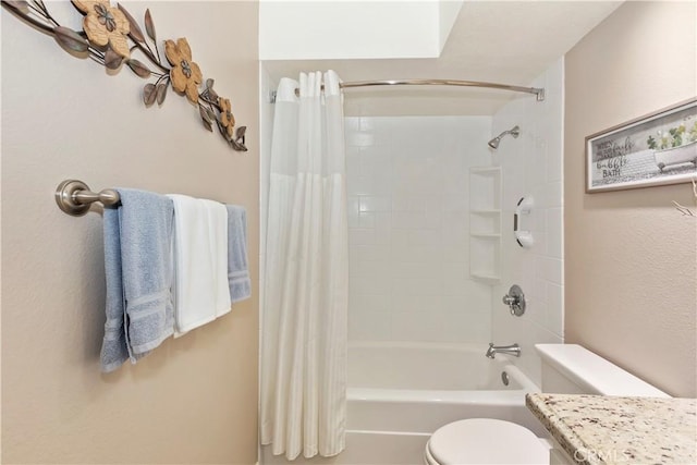 full bathroom featuring toilet and shower / bath combo with shower curtain
