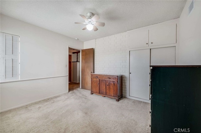 404 N San Jose Ave, Covina, CA 91723 - unfurnished bedroom featuring light carpet, a textured ceiling, ceiling fan, and a closet
