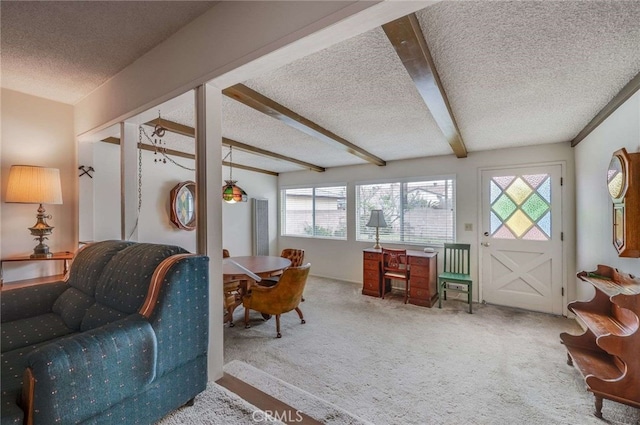 404 N San Jose Ave, Covina, CA 91723 - living room featuring a textured ceiling, carpet flooring, healthy amount of natural light, and beamed ceiling