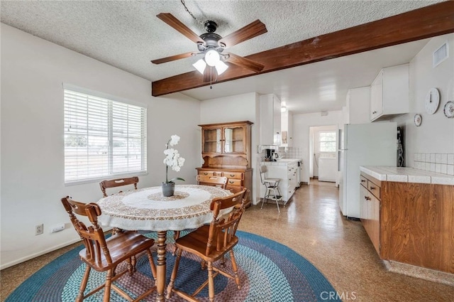 404 N San Jose Ave, Covina, CA 91723 - dining space with a ceiling fan, beam ceiling, a textured ceiling, and baseboards
