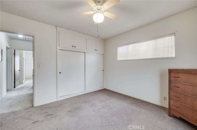 404 N San Jose Ave, Covina, CA 91723 - unfurnished bedroom with light colored carpet, a closet, a ceiling fan, and a textured ceiling