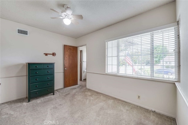 404 N San Jose Ave, Covina, CA 91723 - unfurnished bedroom with light colored carpet, a ceiling fan, and a textured ceiling