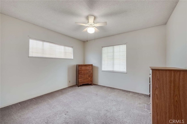 404 N San Jose Ave, Covina, CA 91723 - carpeted empty room with ceiling fan, a textured ceiling, and baseboards