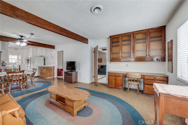 404 N San Jose Ave, Covina, CA 91723 - living room featuring a textured ceiling, ceiling fan, and beam ceiling