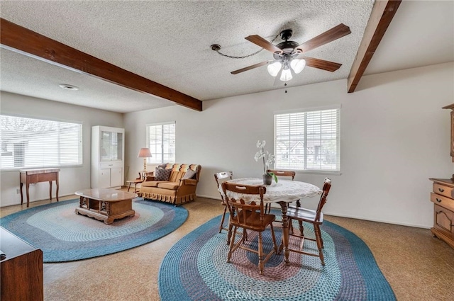 404 N San Jose Ave, Covina, CA 91723 - carpeted dining area featuring beamed ceiling, a textured ceiling, and a ceiling fan