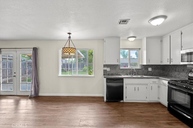 3439 De Anza Ave, Merced, CA 95348 - kitchen featuring black appliances, a sink, a textured ceiling, dark wood-style floors, and tasteful backsplash