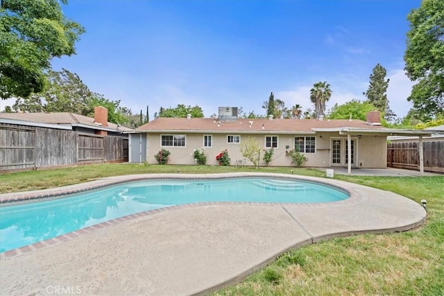 3439 De Anza Ave, Merced, CA 95348 - view of swimming pool featuring a patio and french doors