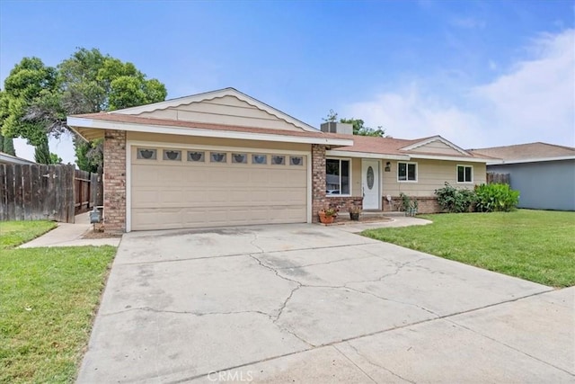 3439 De Anza Ave, Merced, CA 95348 - ranch-style house featuring brick siding, a garage, and driveway