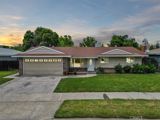 3439 De Anza Ave, Merced, CA 95348 - ranch-style house featuring a garage, concrete driveway, and brick siding