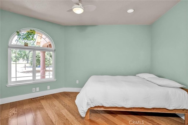 21425 Valley Oak Dr, Middletown, CA 95461 - bedroom featuring baseboards, wood finished floors, a ceiling fan, and recessed lighting