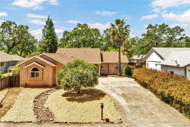 21425 Valley Oak Dr, Middletown, CA 95461 - single story home with stucco siding and fence