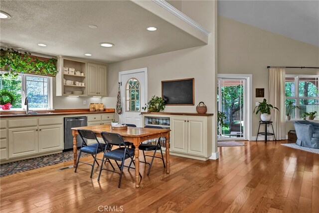 21425 Valley Oak Dr, Middletown, CA 95461 - dining space with light wood finished floors, recessed lighting, a fireplace, high vaulted ceiling, and a textured ceiling