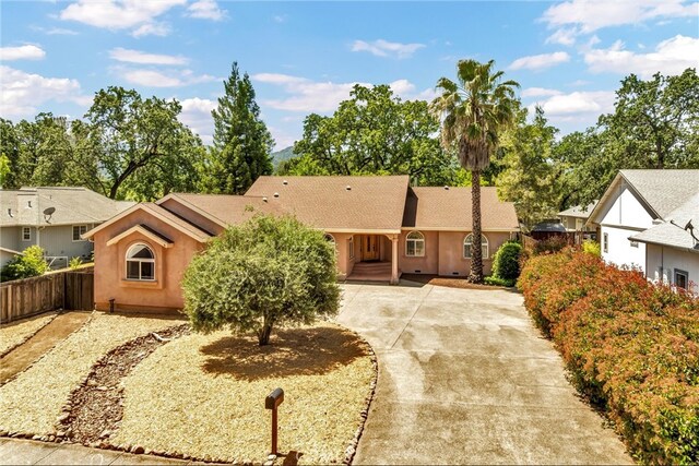 21425 Valley Oak Dr, Middletown, CA 95461 - single story home with stucco siding, fence, and driveway