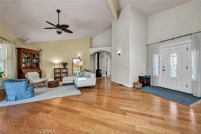 21425 Valley Oak Dr, Middletown, CA 95461 - foyer entrance featuring light wood-type flooring, ceiling fan, arched walkways, high vaulted ceiling, and baseboards