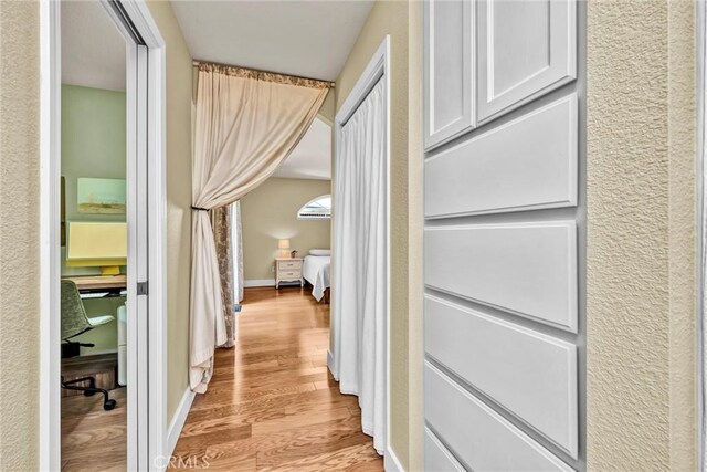 21425 Valley Oak Dr, Middletown, CA 95461 - hallway featuring light wood-type flooring and baseboards