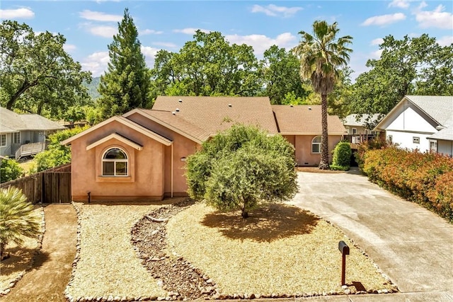 21425 Valley Oak Dr, Middletown, CA 95461 - view of front of house with stucco siding, fence, and driveway