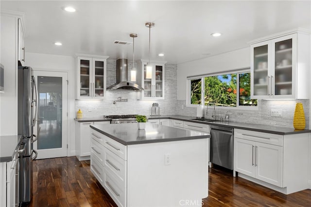 5150 Mountain Springs Ranch Rd, La Verne, CA 91750 - kitchen featuring wall chimney range hood, appliances with stainless steel finishes, a sink, dark countertops, and dark wood-style floors