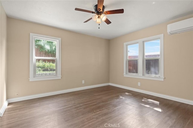 2981 Elgin St, Oroville, CA 95966 - spare room featuring a wall mounted AC, plenty of natural light, and baseboards