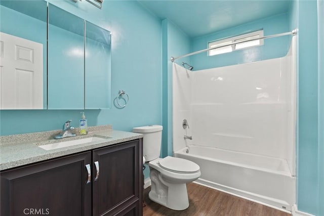 2981 Elgin St, Oroville, CA 95966 - bathroom featuring wood finished floors, toilet, vanity, and shower / bathtub combination