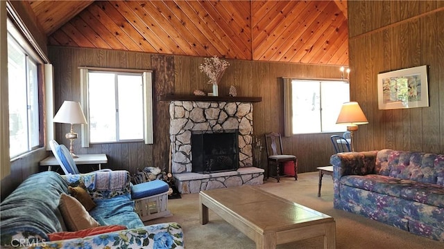 25 Manzanita, Running Springs, CA 92382 - living room with carpet flooring, plenty of natural light, vaulted ceiling, wooden walls, and a fireplace