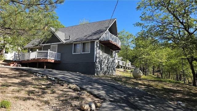25 Manzanita, Running Springs, CA 92382 - view of side of property with a deck, a shingled roof, and a balcony