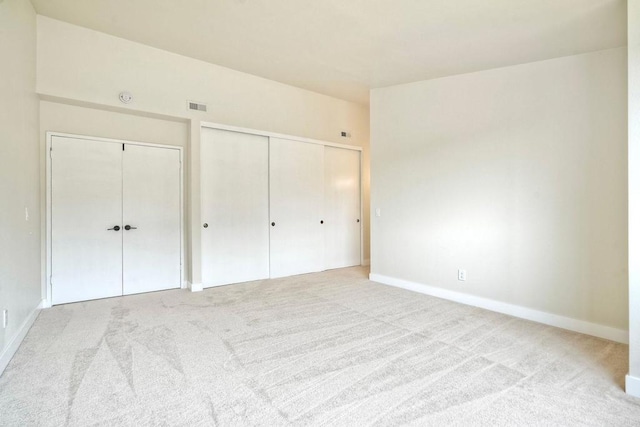 unfurnished bedroom with carpet flooring and baseboards