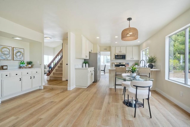 364 Compass Rd, Oceanside, CA 92054 - dining space featuring stairway, light wood-style floors, baseboards, and recessed lighting