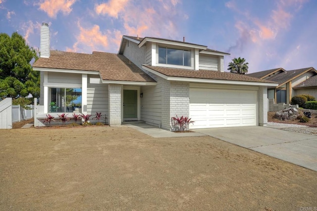 364 Compass Rd, Oceanside, CA 92054 - view of front facade featuring driveway, a chimney, a garage, roof with shingles, and brick siding