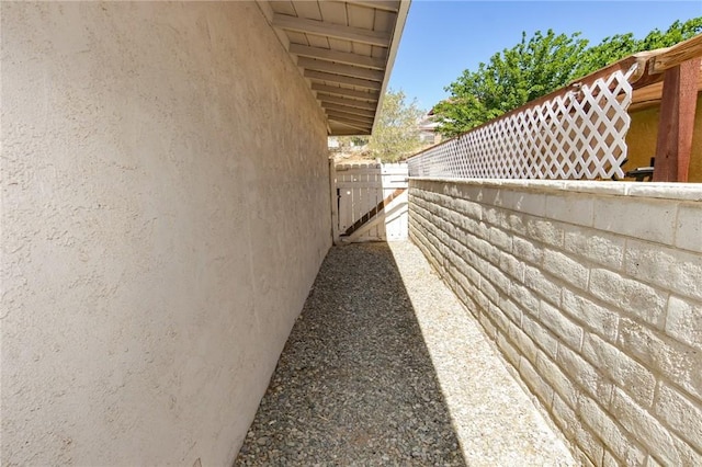 27314 Outrigger Ln, Helendale, CA 92342 - view of side of property featuring stucco siding and fence
