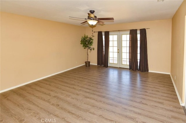 27314 Outrigger Ln, Helendale, CA 92342 - unfurnished room featuring ceiling fan, wood finished floors, baseboards, and french doors