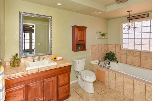 27314 Outrigger Ln, Helendale, CA 92342 - full bathroom with tile patterned flooring, toilet, a bath, a chandelier, and vanity