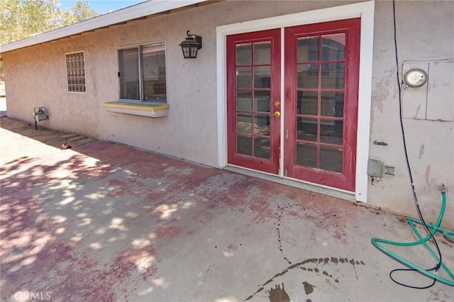 27314 Outrigger Ln, Helendale, CA 92342 - entrance to property featuring a patio, stucco siding, and french doors