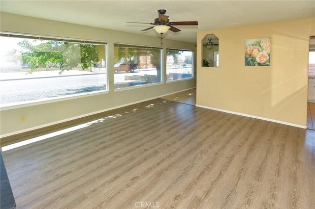 27314 Outrigger Ln, Helendale, CA 92342 - spare room with wood finished floors, baseboards, and a ceiling fan