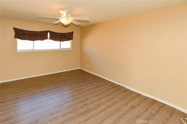 27314 Outrigger Ln, Helendale, CA 92342 - empty room featuring wood finished floors, a ceiling fan, and baseboards