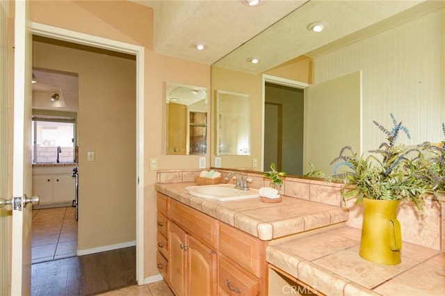 27314 Outrigger Ln, Helendale, CA 92342 - bathroom featuring vanity, baseboards, and tile patterned flooring