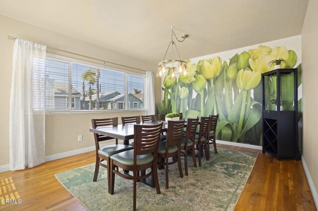 256 Melrose Dr, Oxnard, CA 93035 - dining room with a chandelier, baseboards, and wood finished floors